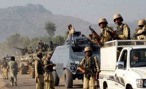 Pakistani soldiers on a patrol this week south of Peshawar. The military recently recaptured a vital road in that area that had been controlled by the Taliban. Photo: Abdul Majeed/New York Times