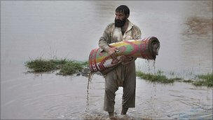 Pakistani rescue teams try to reach tens of thousands of people cut off by floods which are now estimated to have affected three million people. Photo: BBC