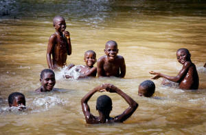 Young boys bathing in a river in Nigeria known to be infected with the parasite that causes river blindness. Some 27 million people in Nigeria need treatment for river blindness, also known as onchocerciasis.  The disease is spread through the bite of a black fly that breeds in fast-flowing water.&nbsp;However, if at-risk people take the drug ivermectin, also known as Mectizan, annually for 15-17 years, the infection cycle is broken for life