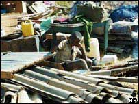 Photo: AP.  Child sits in the rubble of his destroyed home. The Zimbabwean government bulldozed thousands of 'illegal' homes and small businesses affecting approximately  700,000, according to the UN, which in its report on the situation says "he scale of suffering is immense, particularly among widows, single mothers, children, orphans, the elderly and disabled persons." 