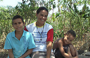 Boost: Maria Joelma da Silva (c.) used state subsidies to build a cistern and start a business selling crops and honey. Photo: Sara Miller Llana/The Christian Science Monitor