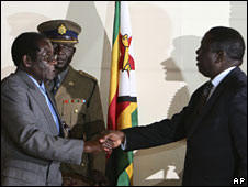 Mr. Mugabe and Mr. Tsvangirai shook hands at their first meeting in a decade. Photo: AP