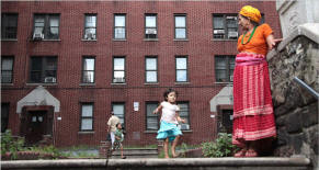 Naramaya Chimoria, 72, keeps an eye on some children. In a role reversal, the older refugees tend to rely on the younger adults � who are more likely to speak English � to navigate the city. Photo: Suzanne DeChillo/The New York Times