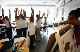 Ellen Evans led a game for her fourth-grade Spanish class in New York, where Harlem's Children Zone started. Photo: Essdras M Suarez/Boston Globe