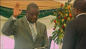 Tsvangirai takes the oath of office. Photo: BBC