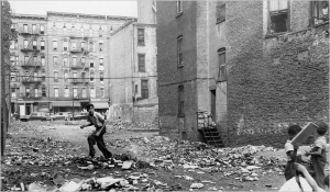 A vacant lot on East 110th Street in New York in 1952. For more than 40 years, 'culture of poverty' explanations for why people are poor have been hotly disputed and mainly out of fashion, because it seemed to  attribute self-perpetuating moral deficiencies to people caught in poverty. Now, after decades of silence, some scholars are conceding that culture and persistent poverty are enmeshed.  Photo: William C. Eckenberg/The New York Times
