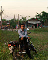 Ravindra Misal--leading the revolution in Umred, a small Indian town. The NYT reporter came to the town to write about a riot, and he discoverd Misal. A few months earlier, power blackouts that rural Indians always suffered silently triggered a violent reaction in Umred. Why? Umred was just another small town in the middle of nowhere, dusty and underwhelming. But Umred had begun to dream, townspeople told me, because of television, because of cousins with tales of call-center jobs and freedom in the city. Once Umred contracted ambition, blackouts became intolerable. A psychological revolution, a revolution in expectations, had taken place. Photo: Bharat Sikka/New York Times