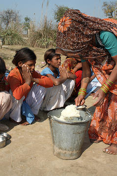 Students get a hot lunch at a school in Beri, India