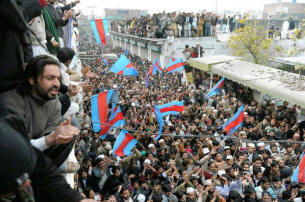 Pakistanis chant slogans as they gather to show their support outside the Rawalpindi home of Mumtaz Hussain Qadri, who is accused of killing Punjab Gov. Salman Taseer. Photo: Aamir Qureshi, AFP/Getty Images