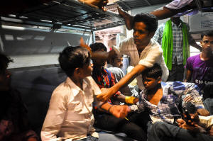 An anti-child labour activist struggles to rescue a young boy during an operation targeting child traffickers. Up to 200,000 children a year fall into the hands of slave traders in India, many sold by their poverty-stricken parents for as little as �11. Now a group of activists has set out to rescue them from a life in the sweatshops of Delhi. Photo:Chamberlain/Guardian