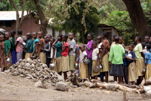 Students line up for lunch at a school in Engaruka, Tanzania in early September.  Photo: Sharon Schmickle/Washington Post