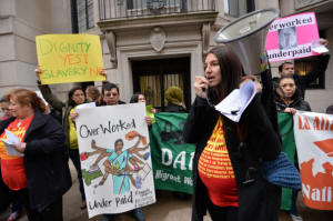 Yomara Velez, right, speaks to a group supporting domestic workers� rights as they demonstrate across the street from the Indian Consulate General, Dec. 20, 2013, in New York. Photo:Stan Honda/AFP/Getty Images