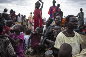 Internally displaced people wait to register for food distribution at a camp at the base of the United Nations Mission in South Sudan in Bentiu, South Sudan.  Photo:Lynsey Addario/New York Times