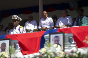  THE CENTER OF POWER President Michel Martelly of Haiti, center, seated between Prime Minister Evans Paul, whose predecessor was ousted in December, and Sophia Martelly, the first lady, who has been targeted in a corruption complaint. Credit Hector Retamal/Agence France-Presse � Getty Images 