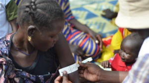 A South Sudanese woman has the circumference of her upper arm taken, which is a measure of malnutrition. Photo: Jason Patinkin/IRIN