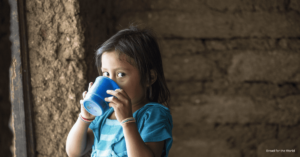 Guatemalan child drinking milk